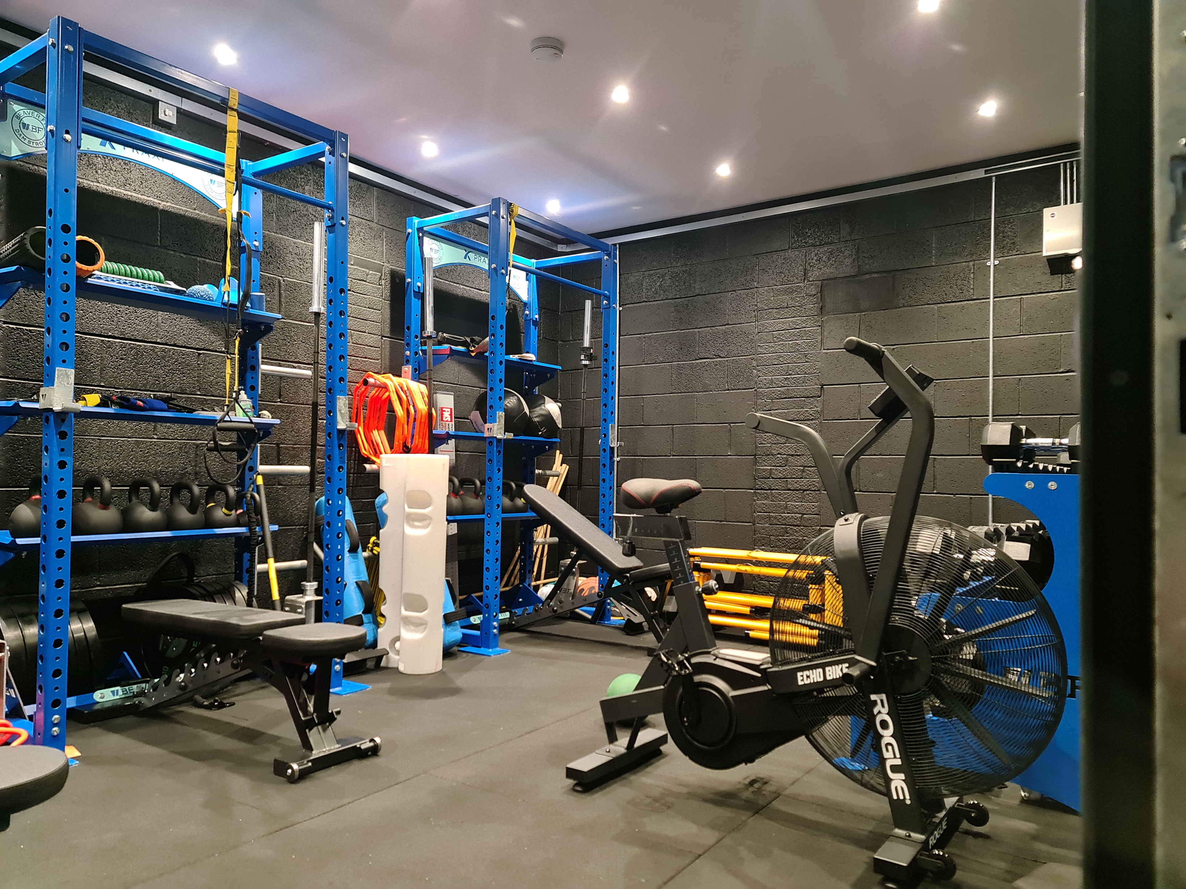 Praxi gym facility with squat racks and training equipment